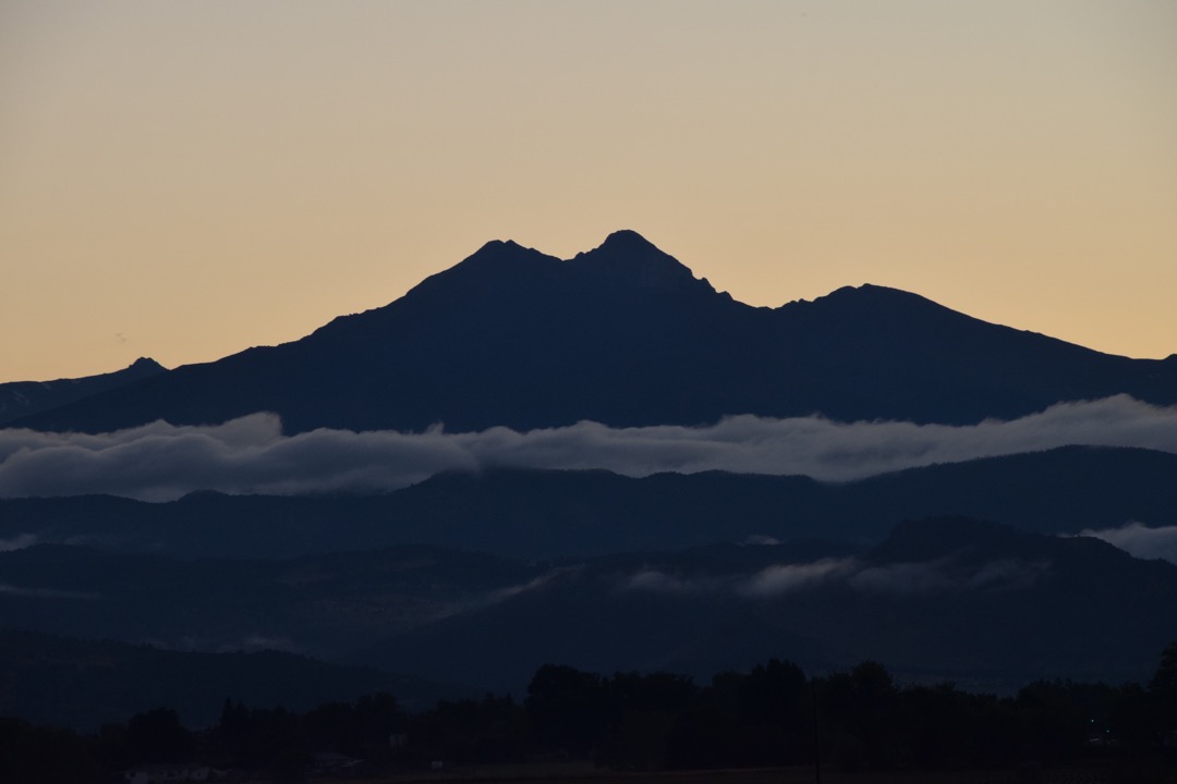 Darmatic outlines and low clouds at sunset over the Front Range