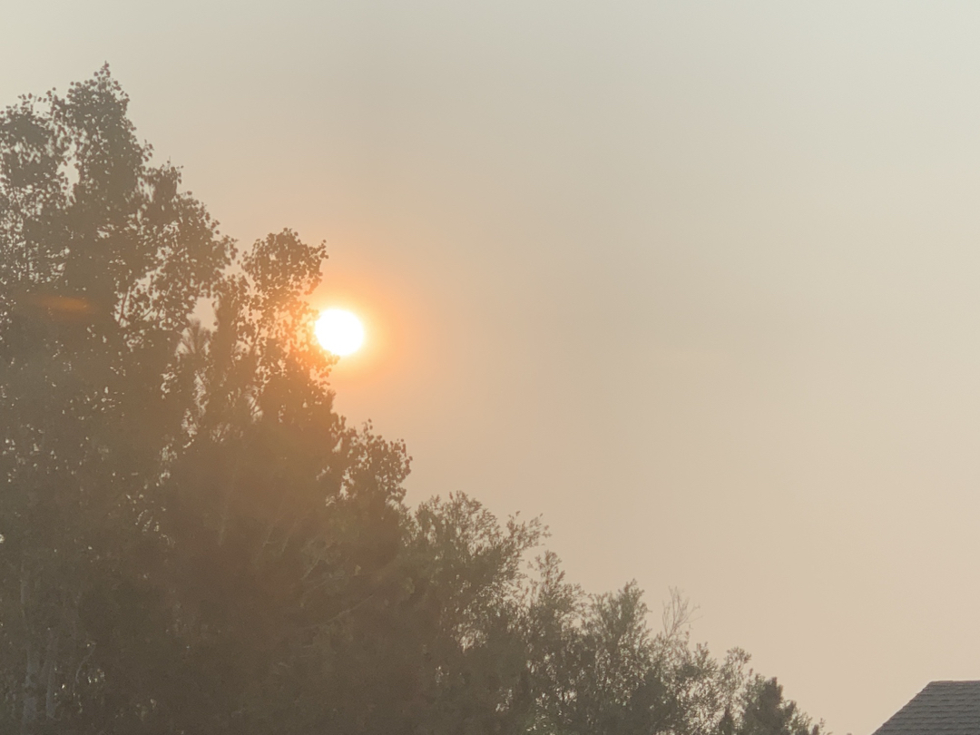 Hazy wildfire sunrise