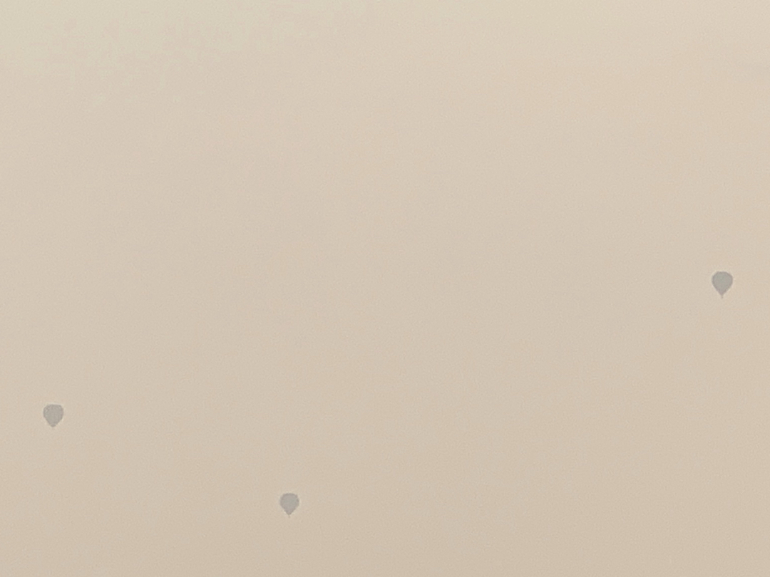 Hot air balloons through wildfire haze