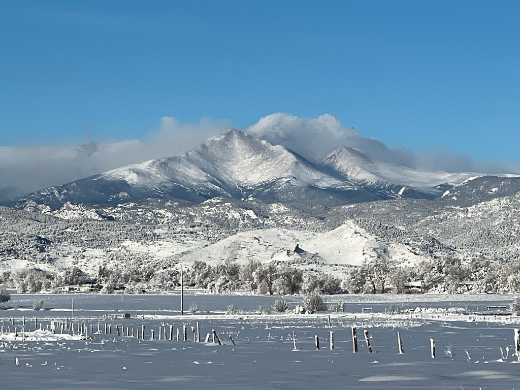 Blue skies and mountain clouds