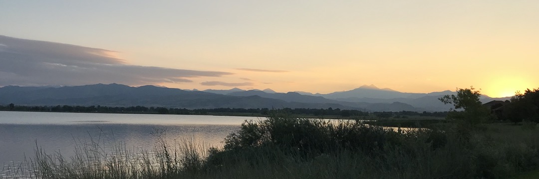 McIntosh Lake with the sun setting on Meeker and Longs Peak