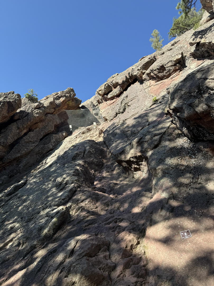 Scramble up to the cave