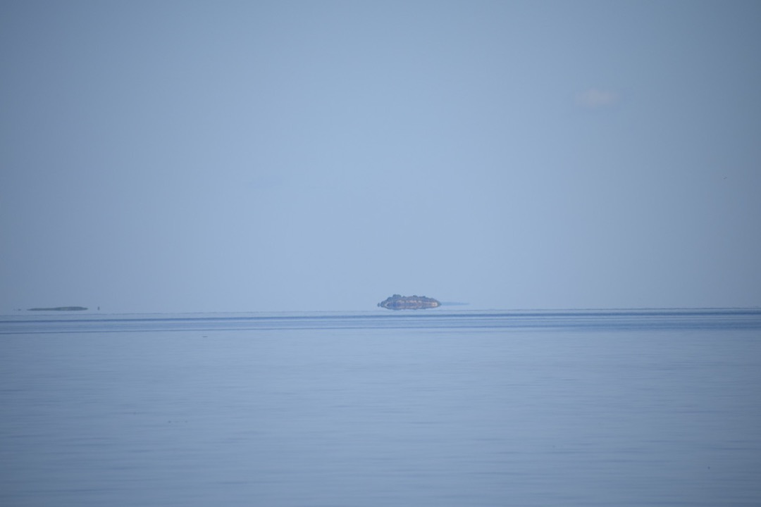 Islands appear to be hovering on the lake